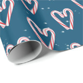 Candy Cane hört und schneebedeckt auf blau Geschenkpapier (Rolleneckpunkt)