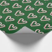 Candy Cane hört und schneebedeckt auf Grün Geschenkpapier (Ecke)