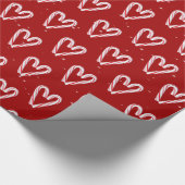 Candy Cane hört und schneebedeckt auf Rot Geschenkpapier (Ecke)