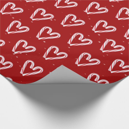 Candy Cane hört und schneebedeckt auf Rot Geschenkpapier (Ecke)