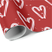 Candy Cane hört und schneebedeckt auf Rot Geschenkpapier (Rolleneckpunkt)