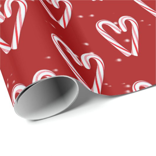 Candy Cane hört und schneebedeckt auf Rot Geschenkpapier (Rolleneckpunkt)