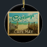 Cape May Beach Vintage Travel Keramik Ornament<br><div class="desc">Diese Gruß aus Cape May Vintage Postkartendesign verfügt über einen Sandstrand mit einem schönen türkisfarbenen Ozean Wasser und über dem Meer,  einen blauen Himmel mit billigen weißen Wolken. Im Vintage Reisen Stil.</div>
