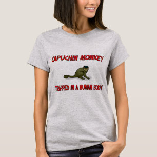 Capuchin-Affe eingeschlossen in einem menschlichen T-Shirt