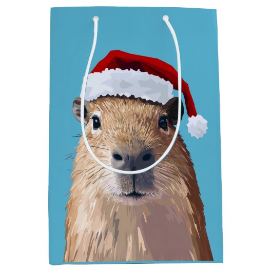 Capybara feierlich in Weihnachtsmannmütze Mittlere Geschenktüte (Vorderseite)