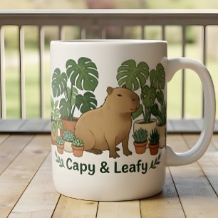 Capybara und grüne Pflanzen – süße Botanik Zweifarbige Tasse