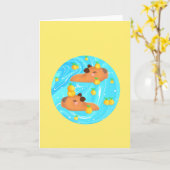 Capybaras in Wasser mit Orangen Karte (Gelbe Blume)
