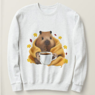 CapyBarri in einer kuscheligen Decke entspannt und Sweatshirt