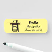 Cartoon-Abbildung der Nähmaschine Namensschild (Beispiel)