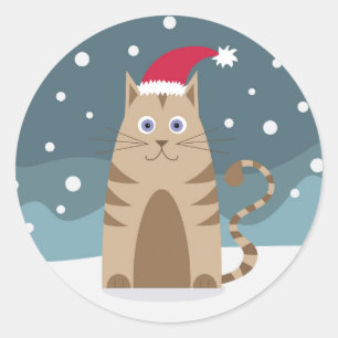Cartoon santa kitten in Schneewald Runder Aufkleber
