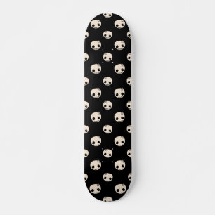 Cartoon Skulls mit Star Bow auf schwarzem Hintergr Skateboard