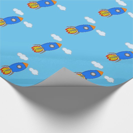 Cartoon Space Rocket in Blue Sky Geschenkpapier (Ecke)