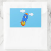 Cartoon Space Rocket in Blue Sky Rechteckiger Aufkleber (Tasche)