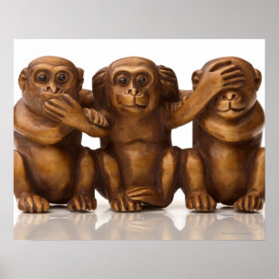 Carving of three wooden monkeys poster