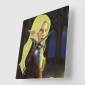 Cassa sitzt an einem Lagerfeuer Quadratische Wanduhr (Winkel)