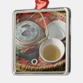 China, Hongkong. Traditionelles chinesisches Teeke Silbernes Ornament (Links)