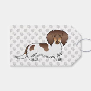 Chocolate- und Tan-Piebald Langhaar-Dachshund und Geschenkanhänger