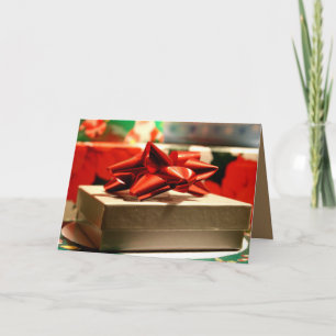 CHRISTMAS GEGENWÄRTIGE KARTE MIT ROTEM RIBONBODEN