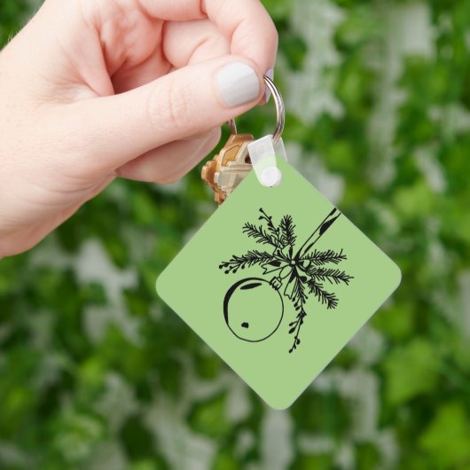 Christmas ornament with bow and pine branch schlüsselanhänger (Hand)