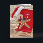 Christmas starfish with Santa hat Feiertagskarte<br><div class="desc">Starfish in beach chair with Santa hat and sunglasses with matching striped bikini bottom</div>