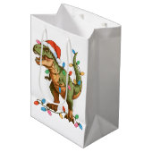 Christmas T Rex Dinosaur Xmas Dino Tyrannosaurus Mittlere Geschenktüte (Vorderseite Schrägansicht)