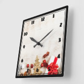 Christmas Themed Items on a Rustic Wooden Board Quadratische Wanduhr (Winkel)