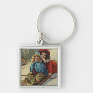 ChristmasTwo kleine Mädchen Sledding Schlüsselanhänger