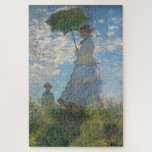 Claude Monet Gemälde von Lady mit Parasol Puzzle<br><div class="desc">Claude Monets "Lady with a Parasol",  die von Frau Monet und ihrem Sohn stammt. Schönes,  eindrucksvolles Gemälde eines perfekten Sommertags. Der blaue Himmel und weiße Wolken schimmern mit den Nuancen der Farbe,  die Monet mit seinen Farben erschaffen konnte.</div>