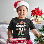 Clingy elect passender Weihnachtsfamilienname Kleinkind T-shirt<br><div class="desc">Mit diesem lustigen Clingy-Elf-T - Shirt, der Teil einer passenden Kollektion für Familienmitglieder ist und Geschenke für Familienmitglieder enthält, kommen Sie in den Urlaubssinn. Dieser T - Shirt ist perfekt für jede Weihnachtsfamilie oder als Familienmitglied geeignet und verfügt über einen niedlichen Elfhut und Beine, mit der Beschriftung "Clingy elf" in...</div>