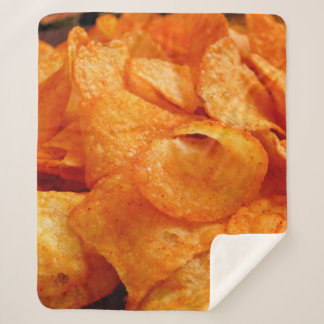 Close up of juicy, crispy, chips on black plate. sherpadecke