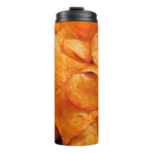 Close up of juicy, crispy, chips on black plate. thermosbecher