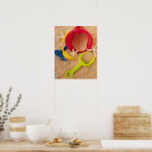 Close up of toys on sand poster (Küche)