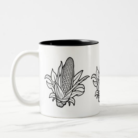 Cob-Ikone mit schwarz-weiß Mais und Blätter Zweifarbige Tasse (Links)