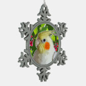 Cockatiel mit grünen, holzigen Blätter und roten B Schneeflocken Zinn-Ornament (Links)