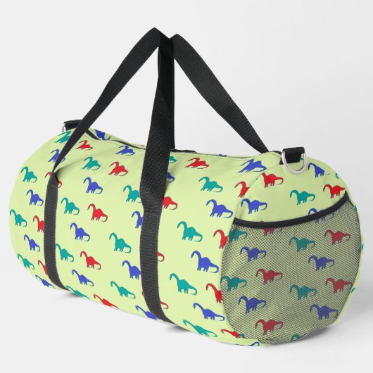 Colorful dinosaurs pattern on green duffle bag (Rechte Ecke)