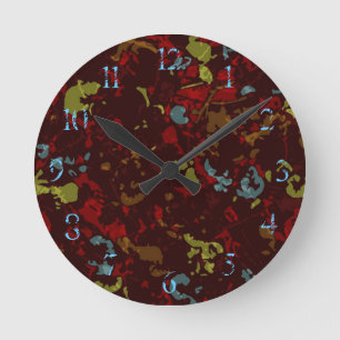 Colorful leaves and flowers against camouflage runde wanduhr