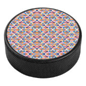 Colorful round speaker with a vibrant geometric  eishockey puck (3/4)
