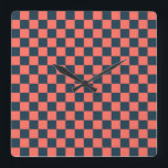 Coral and navy checkerboard pattern quadratische wanduhr<br><div class="desc">A symmetrical,  alternating checkerboard pattern featuring dark blue and pink squares,  conveying a playful and vibrant visual effect.</div>