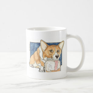 Corgi, der das Erdnussbutter-Glas leckt Kaffeetasse