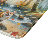 Corgi Hunde in einem Waldlauf mit Herbstfarben Schneidebrett (Ecke)