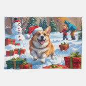 Corgi läuft im Schnee mit Weihnachtshut Geschirrtuch (Horizontal)