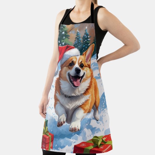 Corgi läuft im Schnee mit Weihnachtshut Schürze (InSitu)