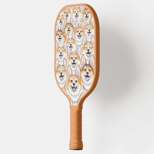 Corgis auf einem Pickleball Paddle (Links)