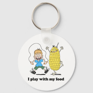 Corncob und Kind spielen Schlüsselanhänger