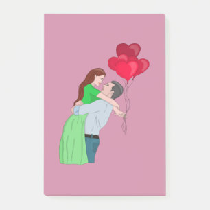 Couple Hugging während des Holens Herz geformt Bal Post-it Klebezettel