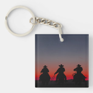 Cowboy bei Sonnenuntergang Schlüsselanhänger