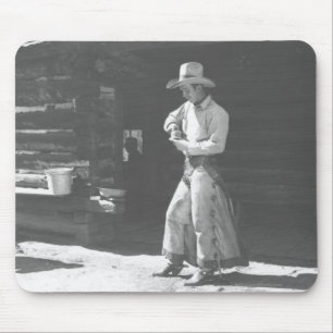 Cowboy, der aus einer Peter-Pan-Erdnussbutterdose Mousepad