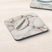 Cowrie-u. Ohrschnecken-Muscheln u. Untersetzer (Linke Seite)