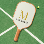 Cream Gold Monogram Personalized Name Luxury Gift  Pickleball Schläger<br><div class="desc">This cream personalized product features a refined gold monogram design with a custom black name below, perfect as a luxury custom gift for her. The soft neutral background combined with the elegant gold letter creates a timeless and sophisticated look. Add any initial and name to create a polished, high end...</div>