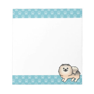 Creme-Sable-Pomeranian-Hund und blaue Ränder Notizblock
